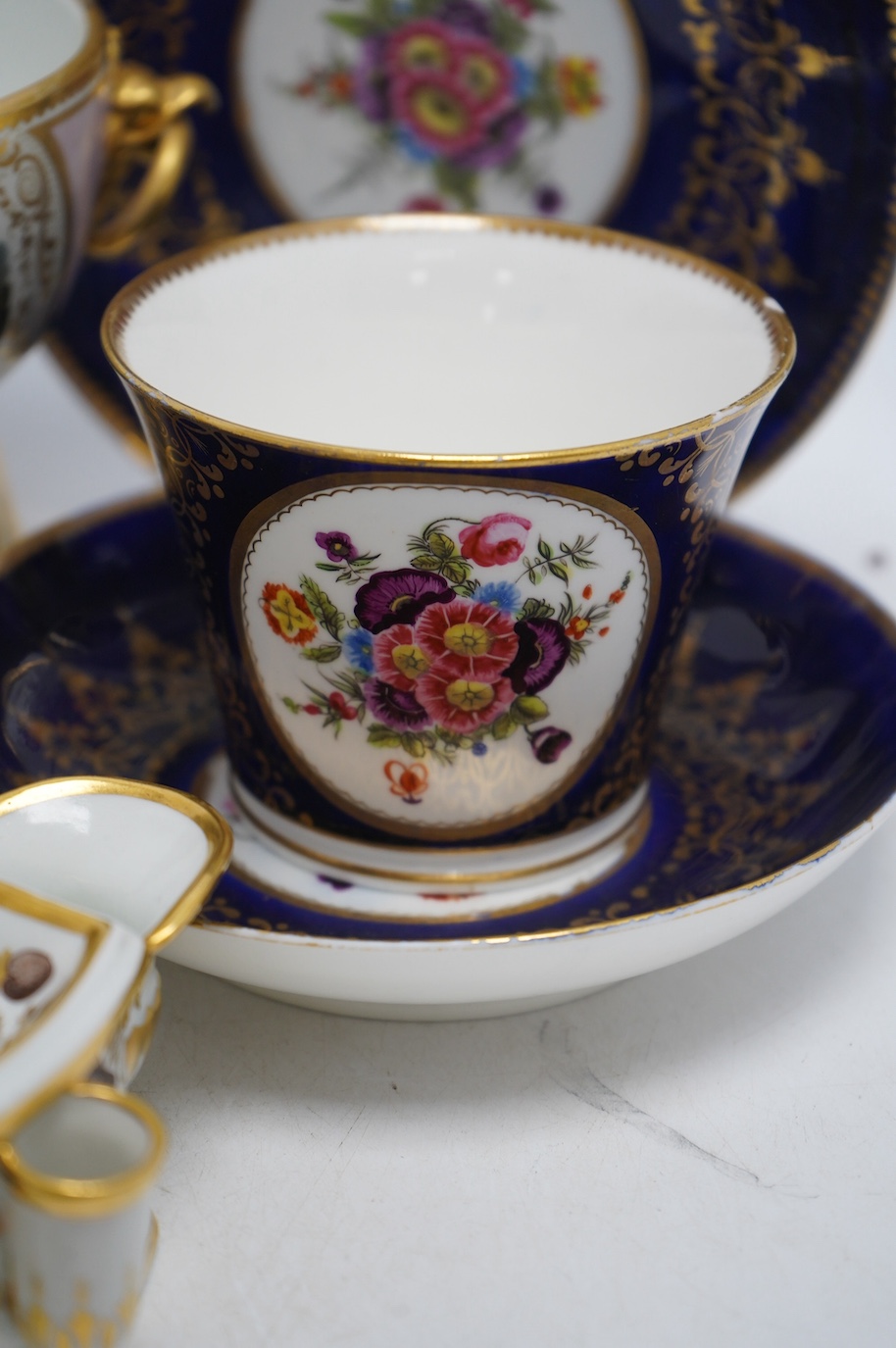 A quantity of 19th century porcelain to include Flight Barr & Barr, Worcester pedestal bowl, two Chamberlains Worcester breakfast trios and ink stand, largest 11cm high. Condition - fair, Flight Barr & Barr restored